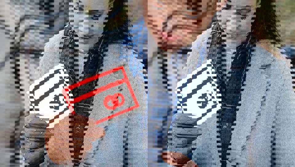 A woman holding a debit card icon