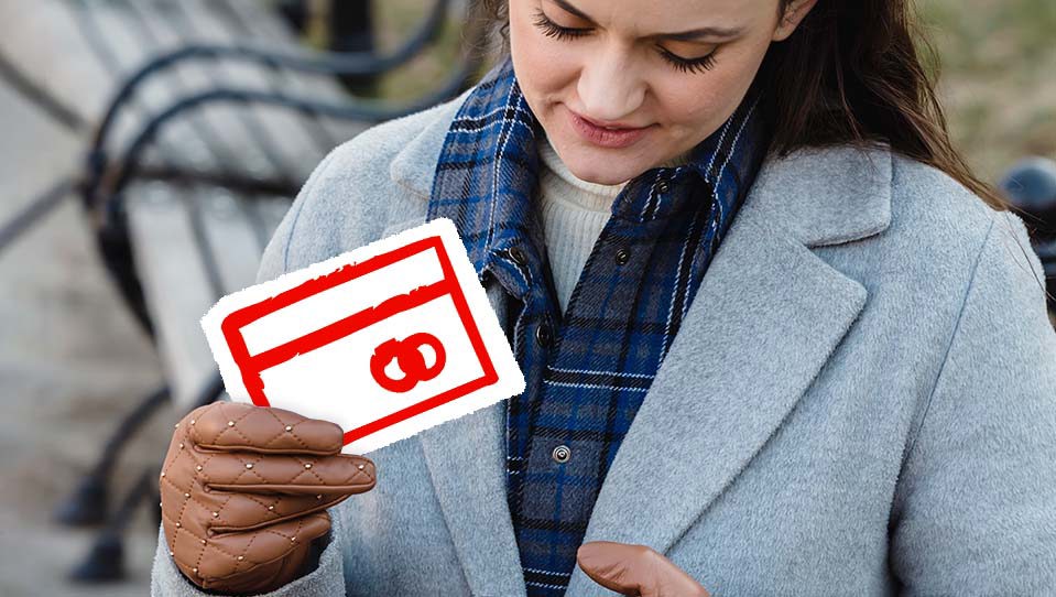 A woman holding a debit card icon