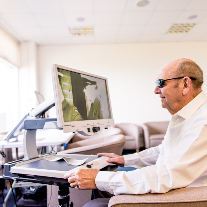 Blind veteran Tony using a CCTV scanner