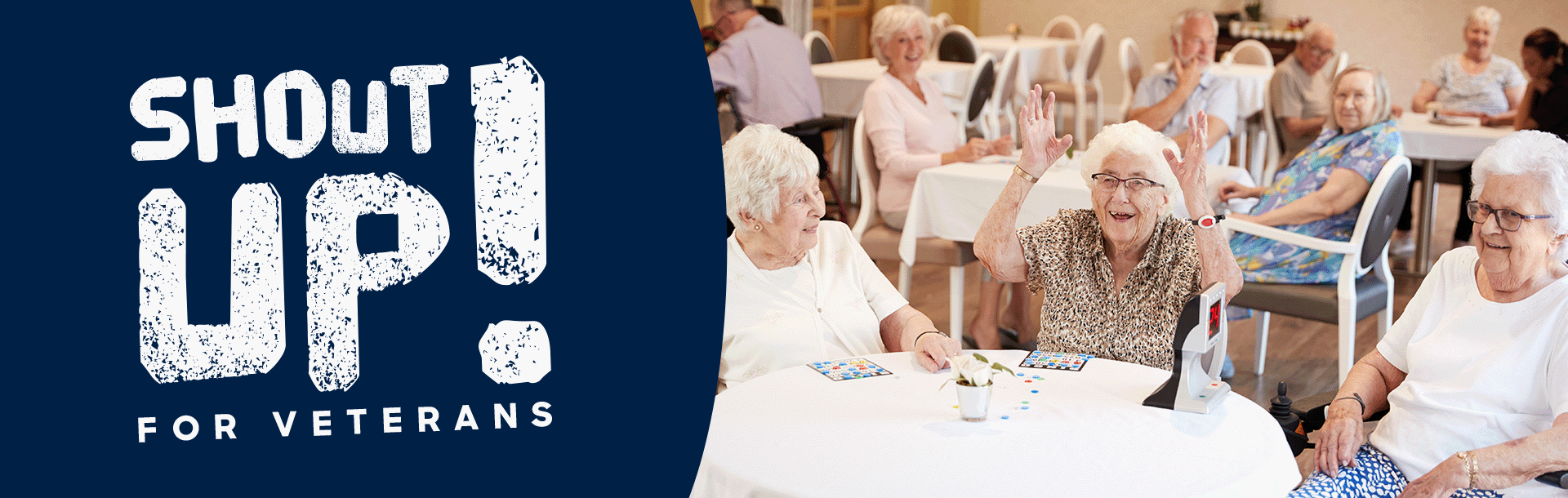 A photo of a group of elderly woman playing bingo with one cheering as she won