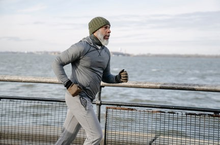 A man jogging by the coast