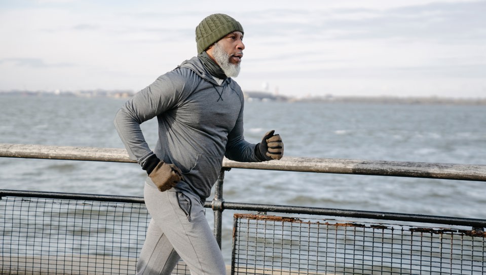 A man jogging by the coast