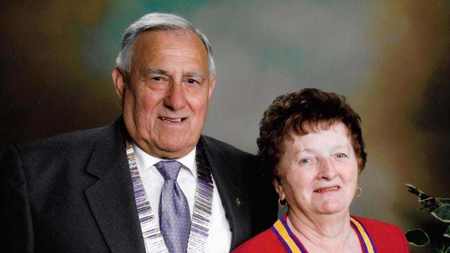 A head-shot of Bob and his late wife dressed smartly, wearing their medals and smiling
