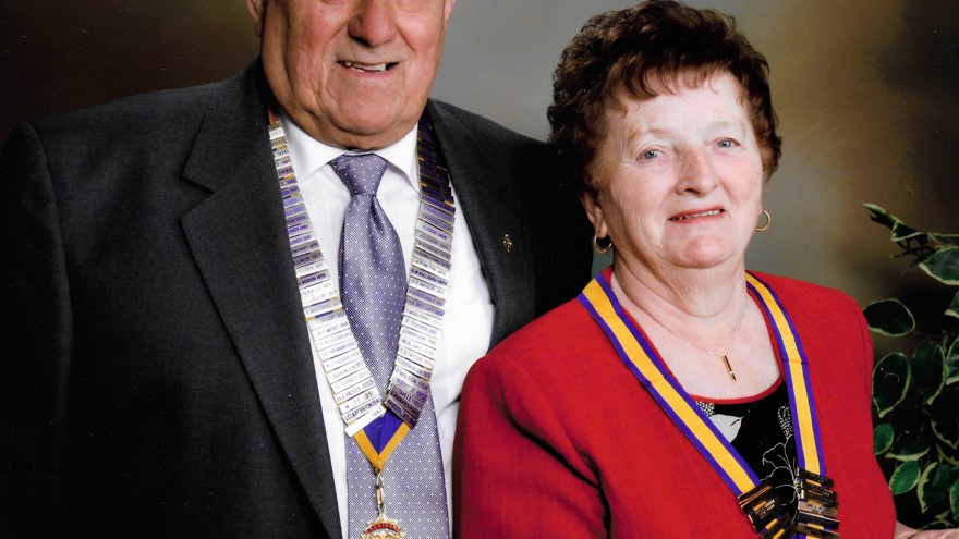 A head-shot of Bob and his late wife dressed smartly, wearing their medals and smiling