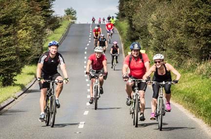 A photo of a group riding bikes for the London to Brighton Cycle
