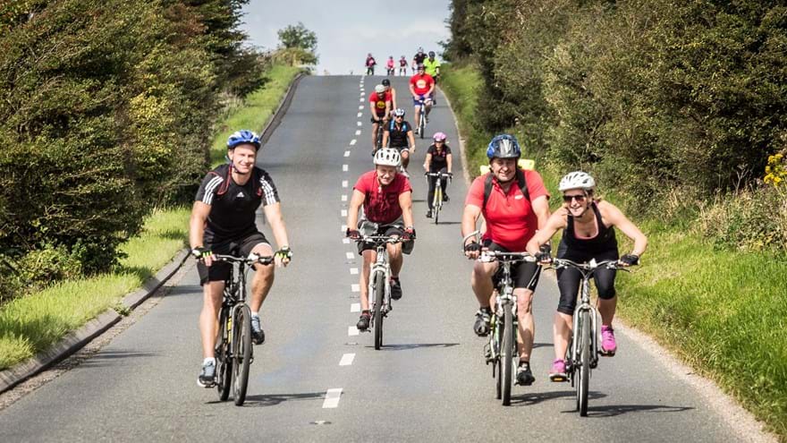 A photo of a group riding bikes for the London to Brighton Cycle