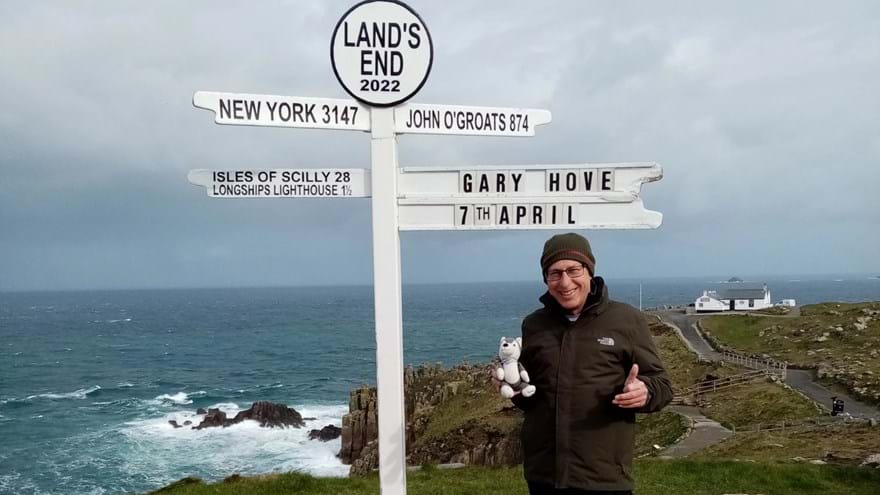 Gary pictured standing next to the Land's End sign