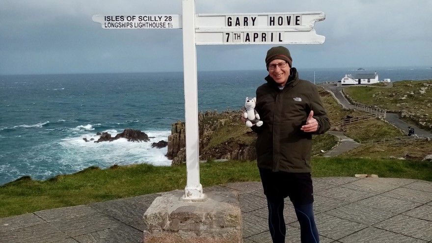 Gary pictured standing next to the Land's End sign