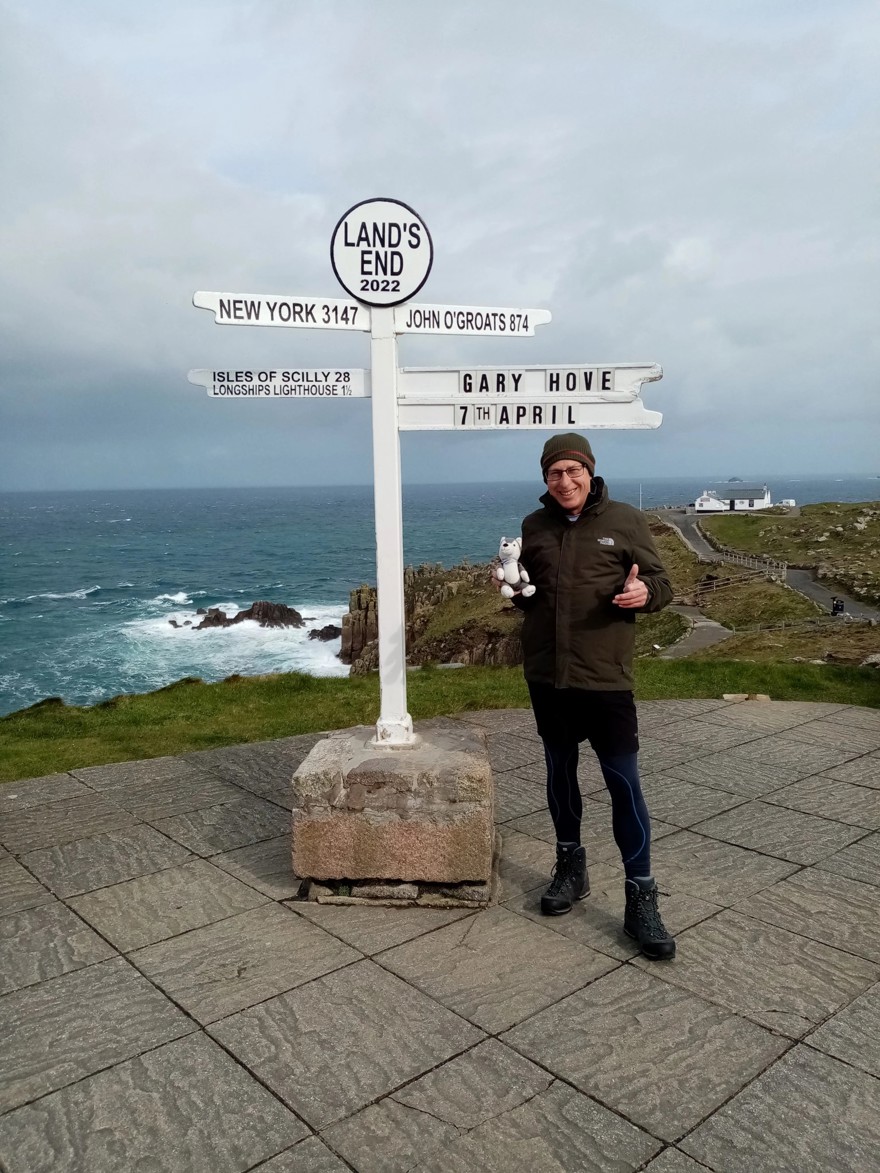 Gary pictured standing next to the Land's End sign