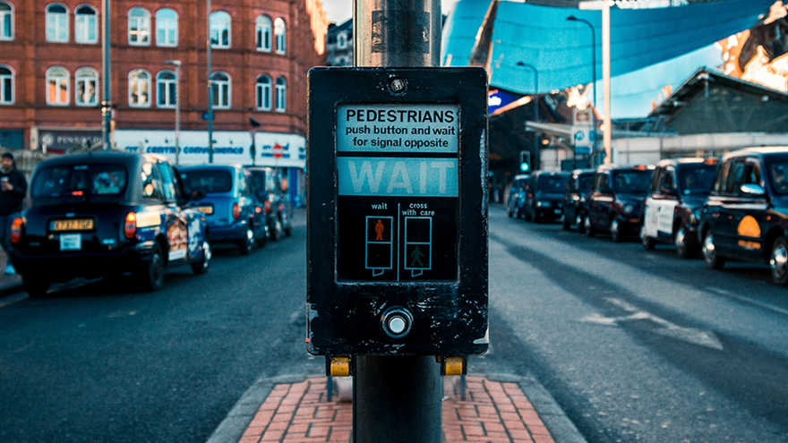 A photo of a push-button box at a pedestrian crossing