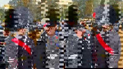 Photo of blind veteran Billy with Guardsmen waiting to start the march at the Cenotaph