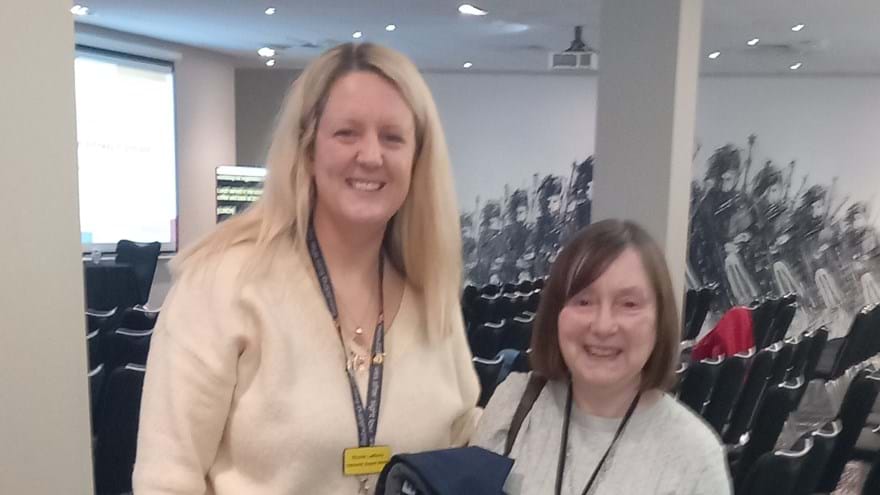 Community Support Worker Nicola and Member Janice with her guide dog Megan at the conference