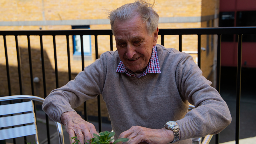 A photo of blind veteran Bob gardening at Harcourt Street