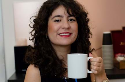 A photo of a woman with a mug