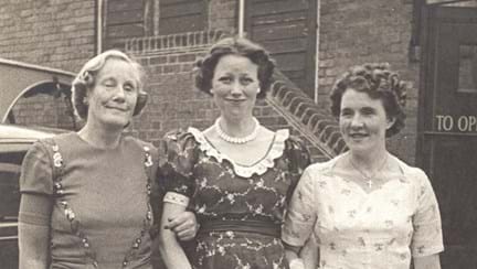 A photo of Gwen Obern (right) and ladies wearing dresses at Church Stretton