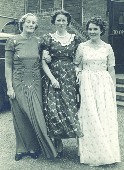 A photo of Gwen Obern (right) and ladies wearing dresses at Church Stretton