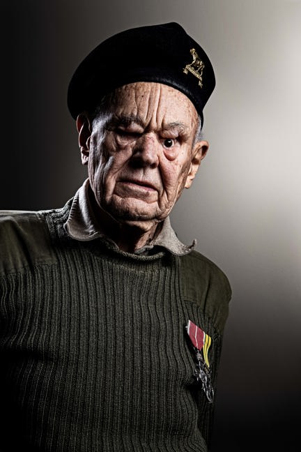 Blind veteran Mike wearing his military beret and medals