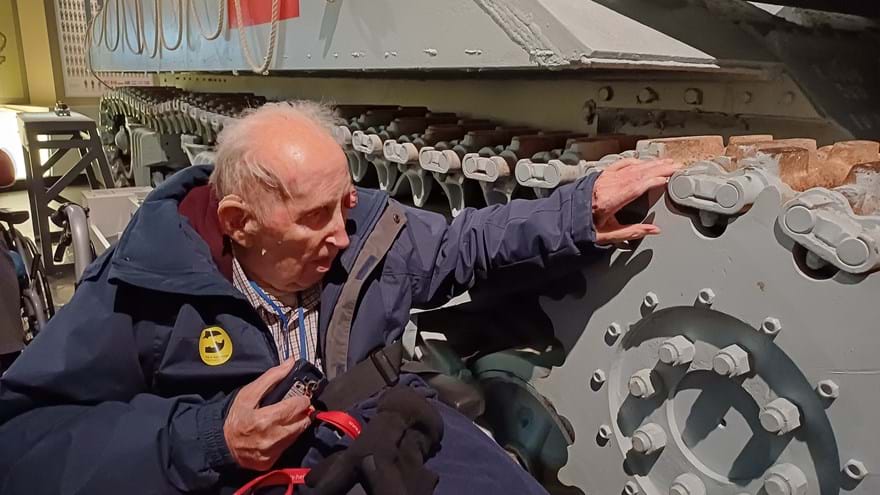 Ken pictured alongside a tank at the D-Day Museum in Portsmouth