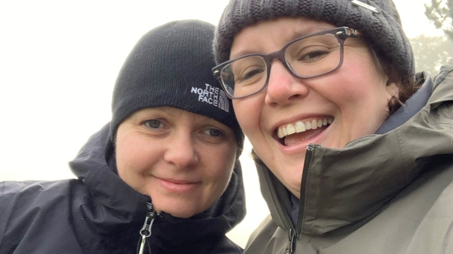 Blind veteran Kelly with her wife Sarah, both wearing red poppies on their winter jackets