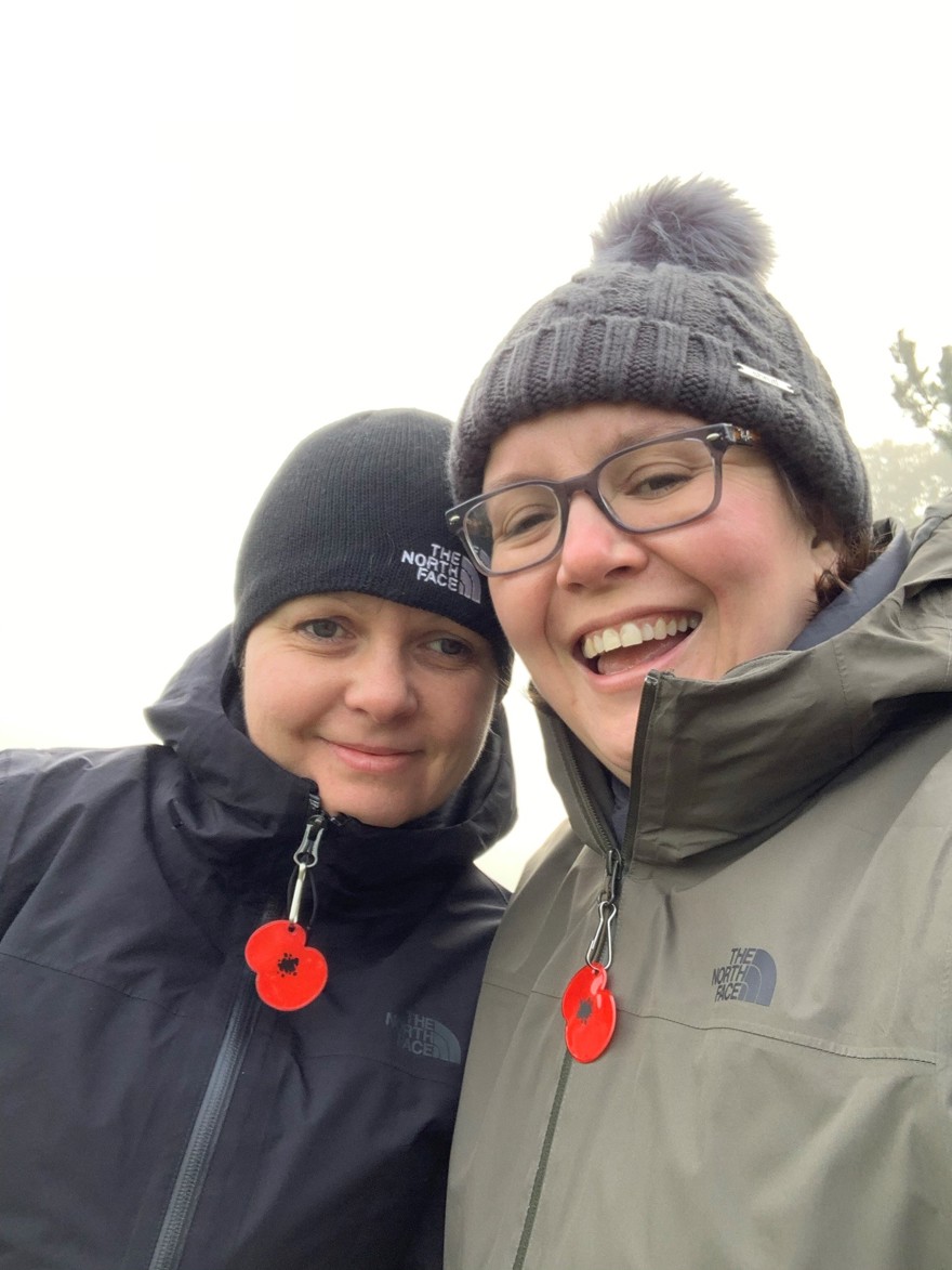 Blind veteran Kelly with her wife Sarah, both wearing red poppies on their winter jackets