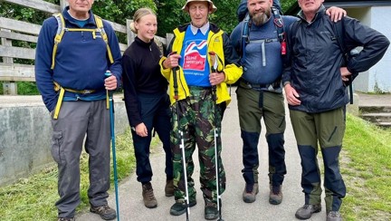 Blind veteran Peter pictured with volunteer Chris, and the rest of his guides after arriving safely back to the visitor centre