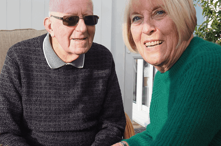 Blind veteran Bob with his carer Barbara