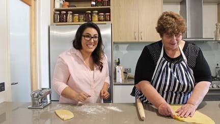 Photo of Melbournes expert Charleen, left, teaches Penny, right, her smoked egg pasta and ravioli