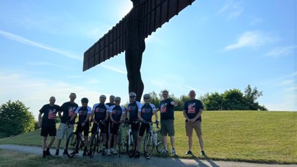 A group of ten stood by the Angel of the North sculpture