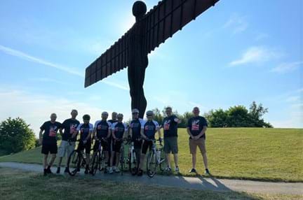 A group of ten stood by the Angel of the North sculpture