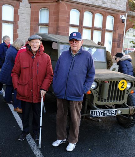 Blind veterans stood in front of a World War Two military vehicle outside the Llandudno Centre of Wellbeing