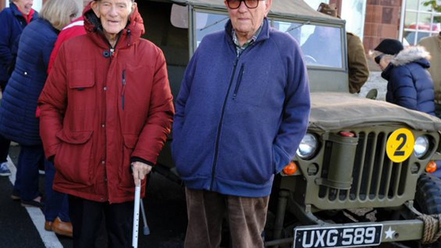 Blind veterans stood in front of a World War Two military vehicle outside the Llandudno Centre of Wellbeing