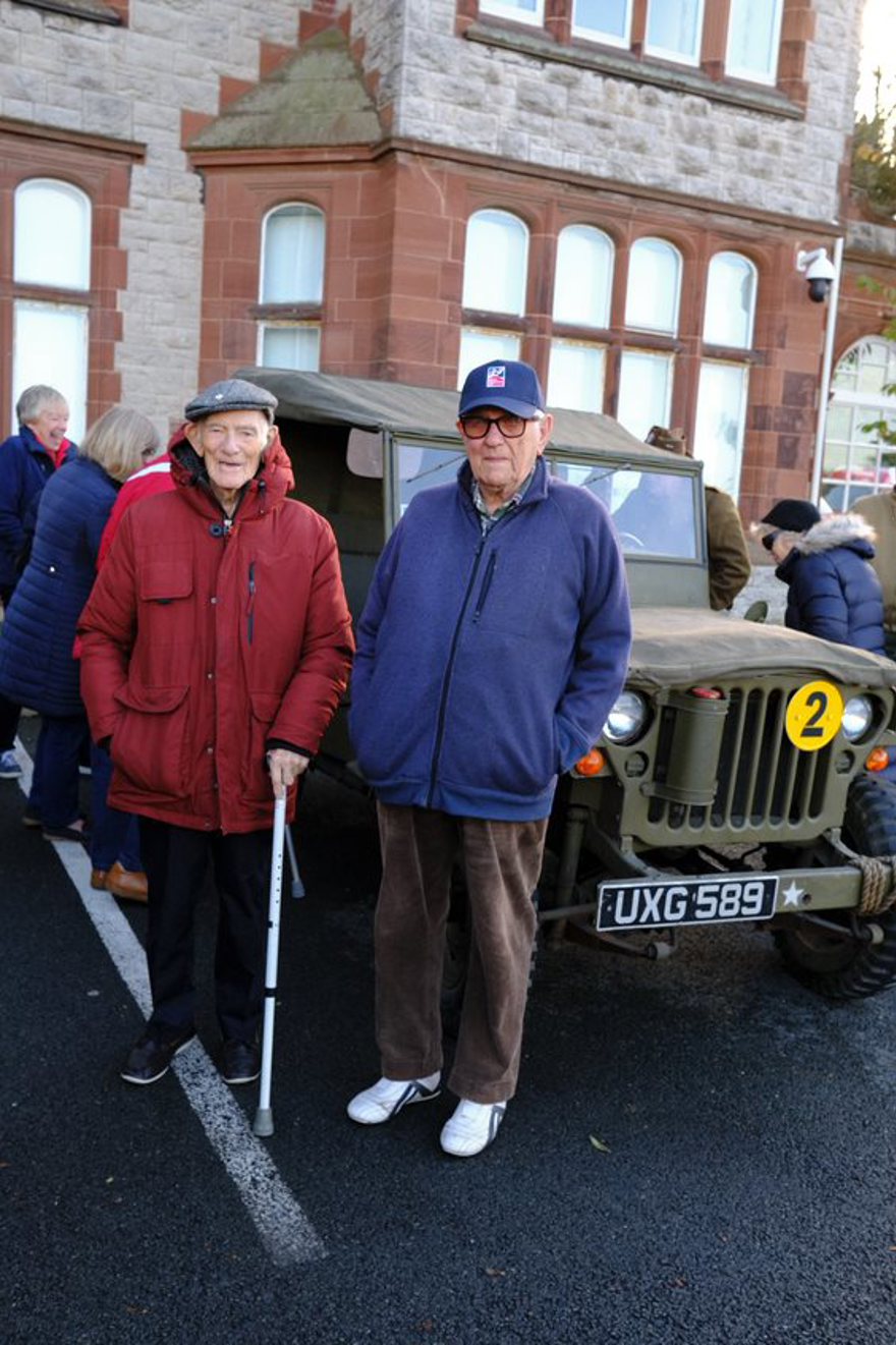 Blind veterans stood in front of a World War Two military vehicle outside the Llandudno Centre of Wellbeing