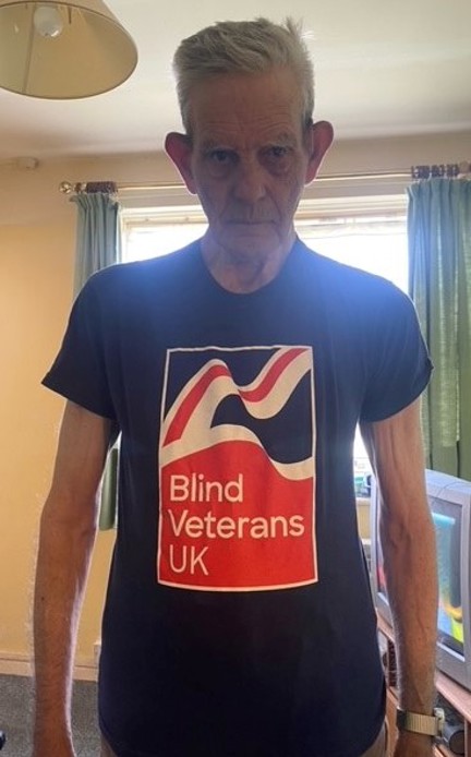 Blind veteran Ron wearing a Blind Veterans UK t-shirt