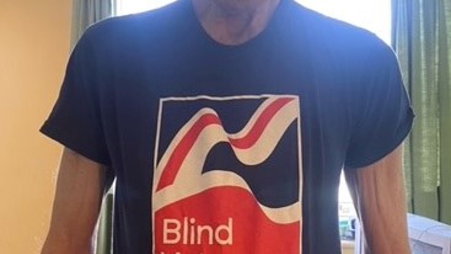 Blind veteran Ron wearing a Blind Veterans UK t-shirt