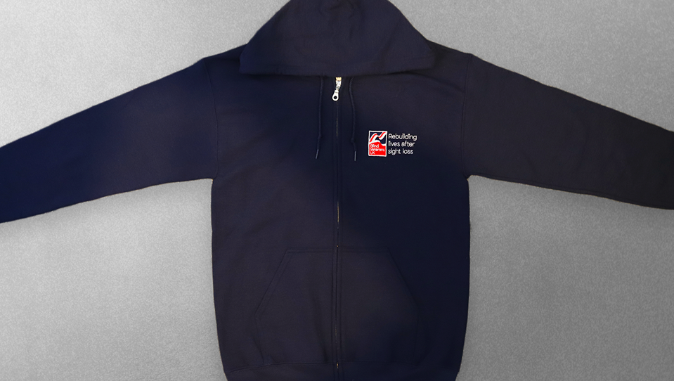 A navy zip hoodie with a Blind Veterans UK logo