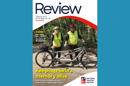 A magazine front cover with title "Keeping Maria's memory alive" and an image of blind veteran Maria and her husband with their tandem bicycle