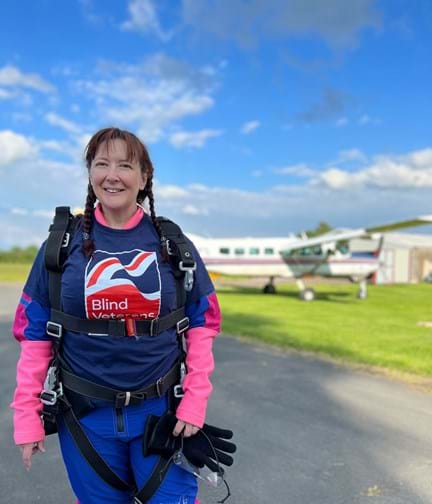 Claire just before her skydive, wearing her harness