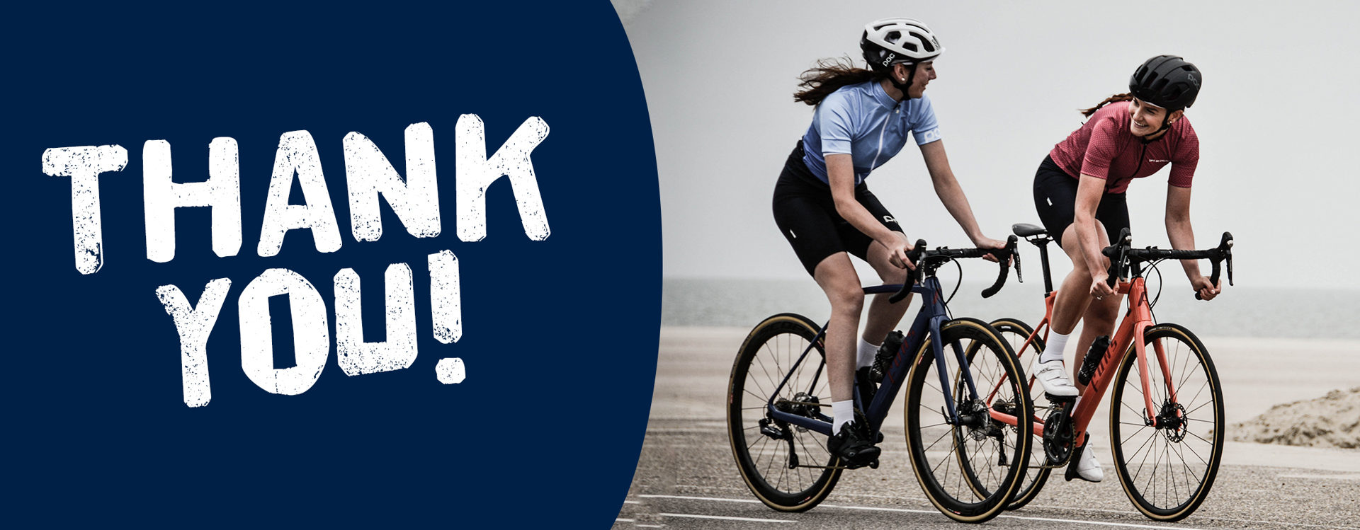 "Thank you!" A photo of two people riding bikes