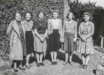 A photo of female munition workers from the 1940s standing together gathered at Church Stretton